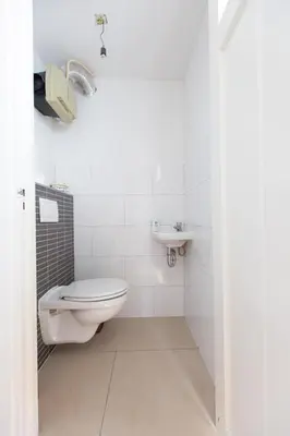a bathroom with a toilet and a sink at Big Room in Amsterdam