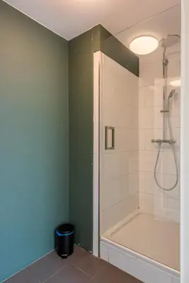 a bathroom with a shower and a bath tub at Big Room in Amsterdam