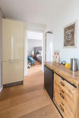 a kitchen with a wooden counter top in a room at Big Room in Amsterdam