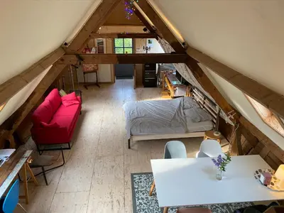 an overhead view of a living room with a attic at De Windroos | Atelier Aan Zee in Groet
