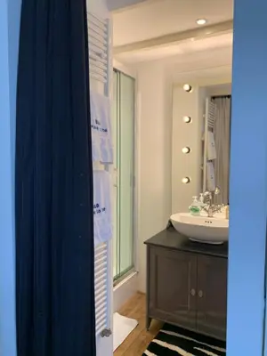 a bathroom with a sink and a mirror at Place To Be in Naarden