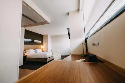 a hotel room with a bed and a window at Hyatt Place Amsterdam Airport in Hoofddorp