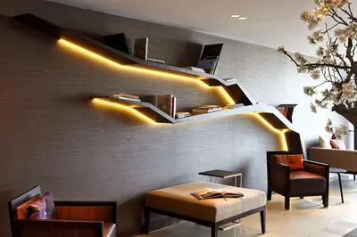 a restaurant with a wall with lights on it at Hyatt Place Amsterdam Airport in Hoofddorp