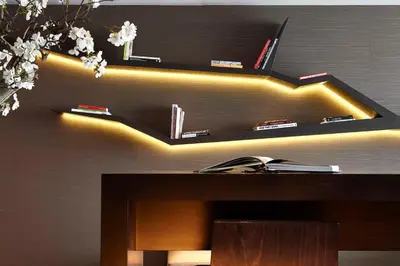 a black shelf with lights on a wall at Hyatt Place Amsterdam Airport in Hoofddorp