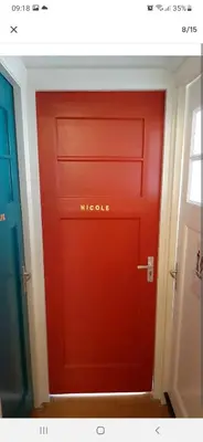a red door with the words michole on it at NICOLE, not for parties, not a hotel, room with shared bathroom, no kitchen in Amsterdam