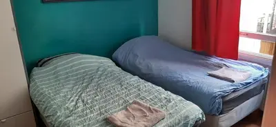a small bedroom with a bed and a window at NICOLE, not for parties, not a hotel, room with shared bathroom, no kitchen in Amsterdam