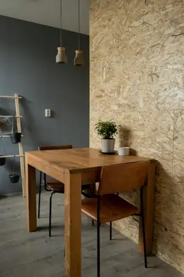 a wooden table with a potted plant on top of it at Bed and Breakfast du Parc in Zaandam