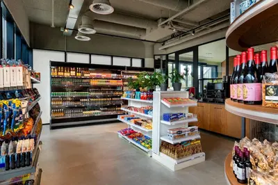 a grocery store with a lot of bottles of wine at Corendon Amsterdam Schiphol Airport, a Tribute Portfolio Hotel in Badhoevedorp