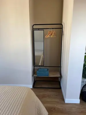 a mirror on a shelf in a room at Weltevreden in Noordwijk