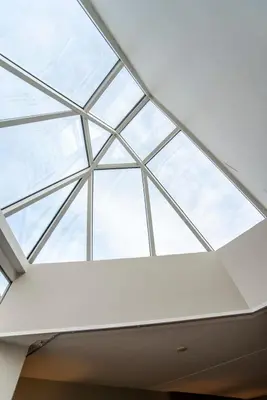 a skylight window in a ceiling in a building at Suite with stunning sea view in Zandvoort