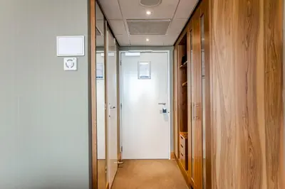a hallway with a door leading into a room at Suite with stunning sea view in Zandvoort