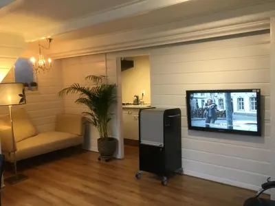 a living room with a flat screen tv on a wall at Family fisherman's house Volendam in Volendam