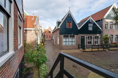 a view of a street in a town with houses at Family fisherman's house Volendam in Volendam