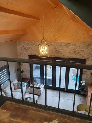 a chandelier hanging from the ceiling of a living room at Tjotter in Amsterdam