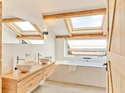 two sinks in a bathroom with skylights at Dutchen Erfgoedpark De Hoop Vakantiewoningen in Uitgeest