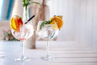 two glasses with fruit in them on a table at Rijk aan Zee Ecolodges in Wijk aan Zee