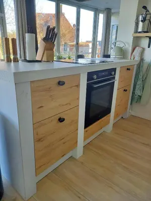 a kitchen with a counter with a stove top oven at Pura Vida del Rio in Oud-Ade
