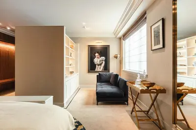 a bedroom with a bed and a chair and a desk at Hotel 717 in Amsterdam
