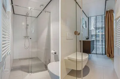 a bathroom with a toilet and a glass shower at Bens The Highdocks in Amsterdam