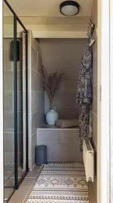 a bathroom with a walk in shower with a toilet at Wellness Lodge aan de Braassem in Rijnsaterwoude