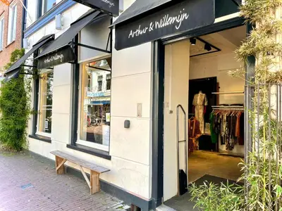 a store front with a bench in front of it at Saya Boutique Hotel in Amersfoort