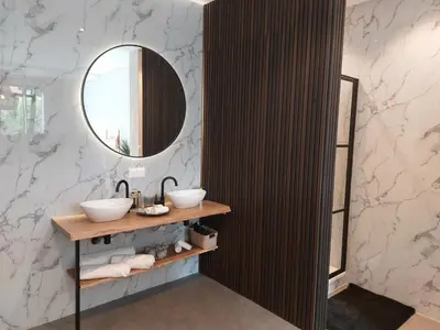 a bathroom with two sinks and a mirror at Saya Boutique Hotel in Amersfoort