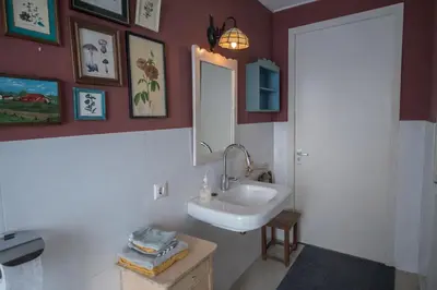 a bathroom with a sink and a mirror at Beautiful Countryside house, close to Amsterdam in Broek in Waterland