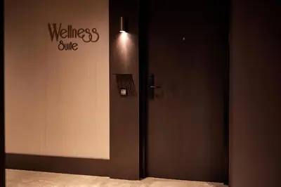 a door in a room with a welcome clinic sign at Van der Valk Hotel Lelystad in Lelystad