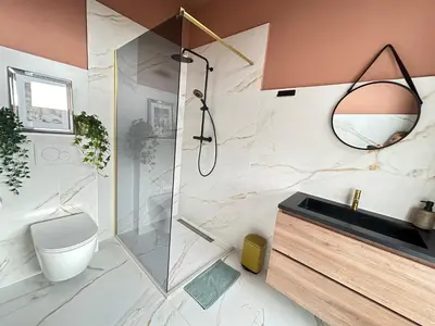 a bathroom with a shower and a toilet and a sink at Lovely Spacious Apartment in Zandvoort