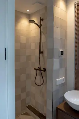 a bathroom with a shower and a sink at The Lake Inn in Nieuwkoop