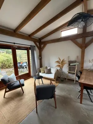 a living room with a couch and a table at Zantverde in Zandvoort