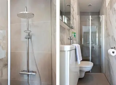 a bathroom with a toilet and a sink and a shower at Bed & Beach 023 in Zandvoort