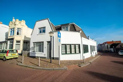 a white building on the side of a street at Sandy's Family Beach House for 2 adults & 2 children in Zandvoort