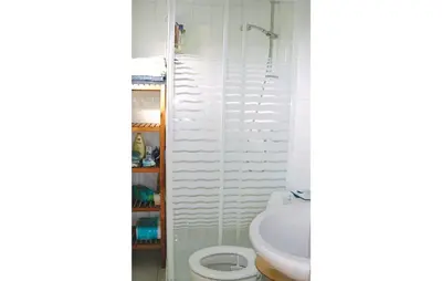 a bathroom with a toilet and a sink at Chalet in Breukelen