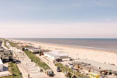 an aerial view of a beach with people on it at Apartment Pascalle in Zandvoort