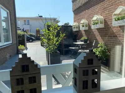 a balcony with a building on the side of a building at Shorestay Zandvoort Beachhouse in Zandvoort