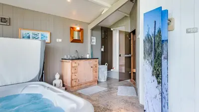 a bathroom with a tub and a sink at Spa house in Bergen