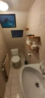 a bathroom with a tub and a toilet and a sink at IRU, not for parties, not a hotel, room with no kitchen in Amsterdam