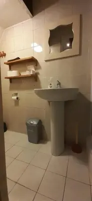 a bathroom with a sink and a trash can at IRU, not for parties, not a hotel, room with no kitchen in Amsterdam