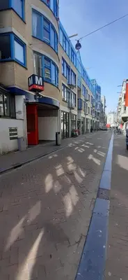 an empty street in a city with a building at IRU, not for parties, not a hotel, room with no kitchen in Amsterdam