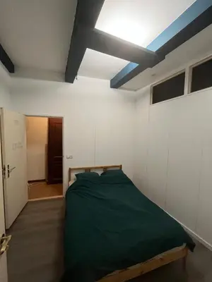 a bedroom with a bed and a blue ceiling at IRU, not for parties, not a hotel, room with no kitchen in Amsterdam