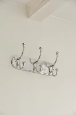 a silver towel rack hanging on a wall at Spiegelgracht Apartments with Canal View in Amsterdam