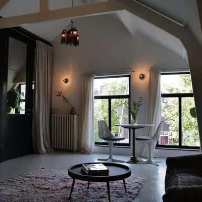 a living room with a couch and a table at Boutique B&B in Edam in Edam
