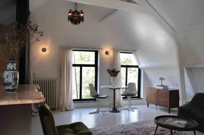 a living room with a couch and a table at Boutique B&B in Edam in Edam