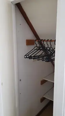 a staircase in a room with a metal rack at T-Rots, prachtig zomerhuis in Noordwijk aan Zee
