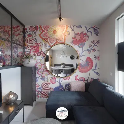 a living room with a couch and a mirror at BB aan de Zuyderzee in Bunschoten