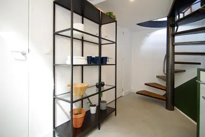 a shelf in a room with plants and pots at Magnificent houseboat with a stunning view! in Amsterdam