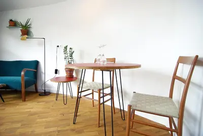 a table in a room with chairs and a table at Magnificent houseboat with a stunning view! in Amsterdam