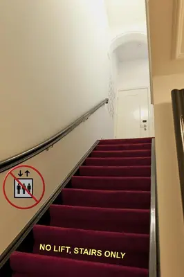 a staircase with a no lift stairs only sign on it at Amsterdam Rembrandt Square city center Hotel in Amsterdam