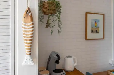 a kitchen with a counter top with a blender at Nina's Beach House 1 